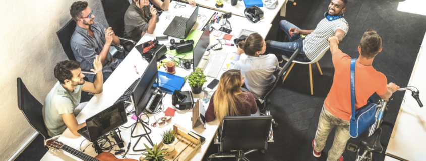 team working together hand in hand in a room
